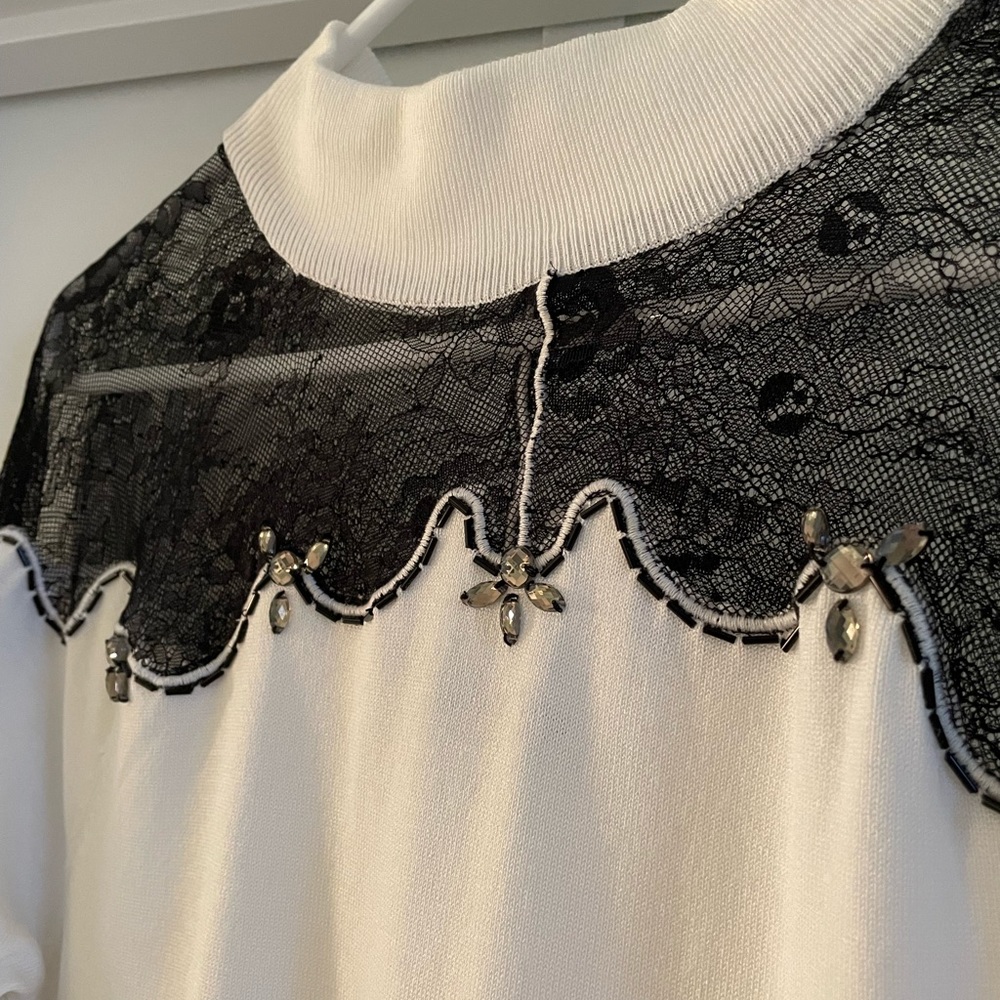 White knit dress with black lace and jewels